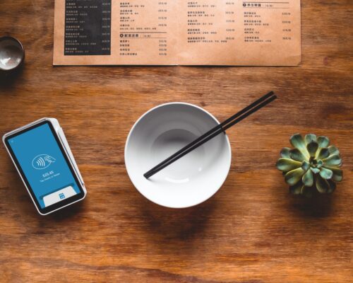 black chopsticks in white ceramic bowl on table